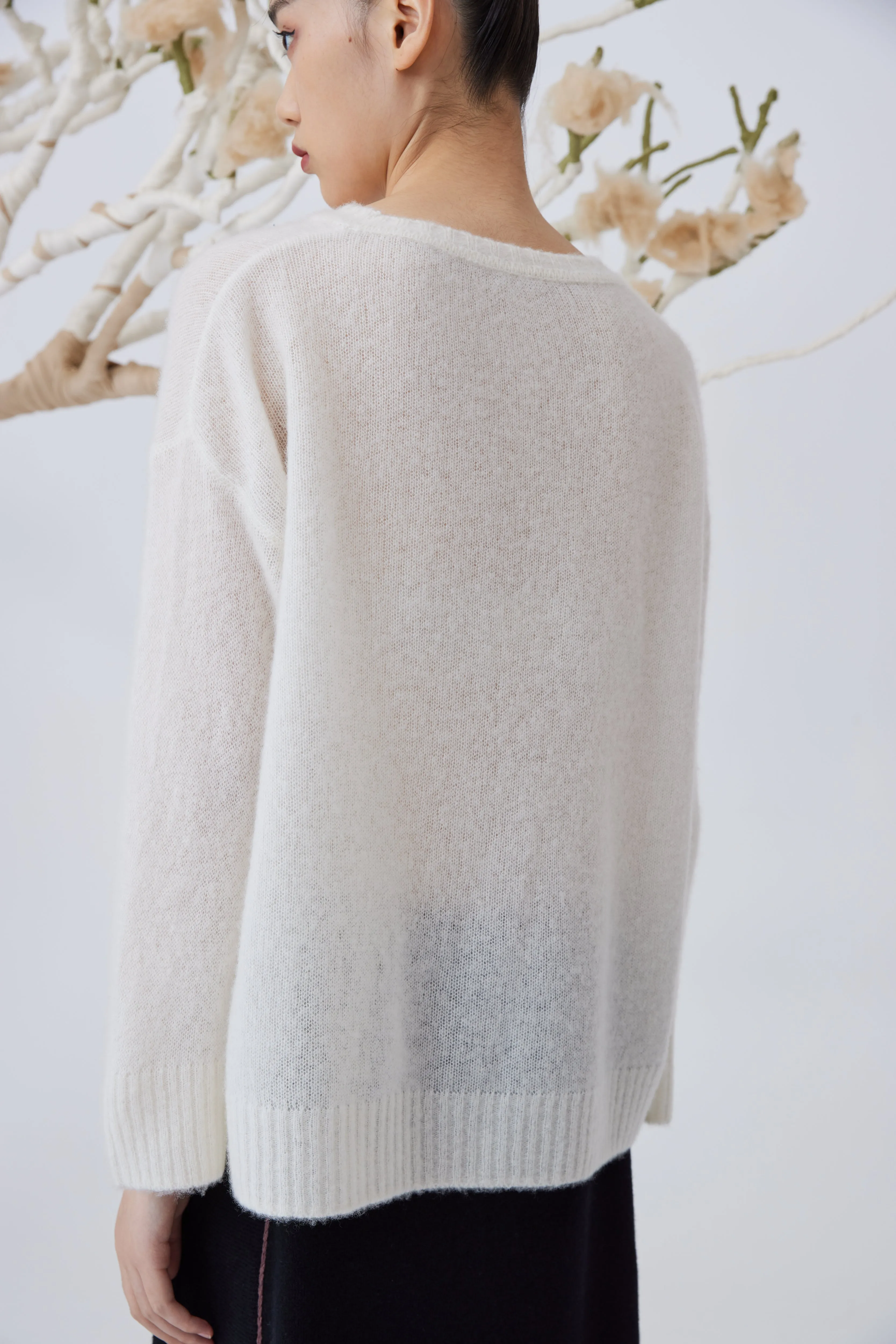 Women's flower embellished top